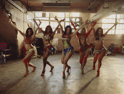 Group of Women Dancing With Arms Outstretched