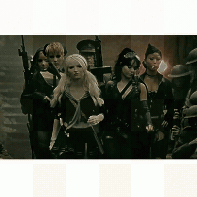Group Of Women Holding Guns In A Line GIF