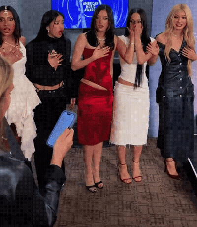 Group Of Women In Front Of American Music Award Screen GIF