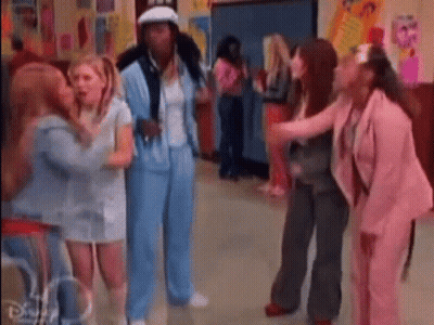 Group Of Women In Hallway GIF