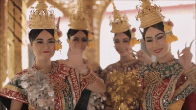 Group Of Women In Traditional Costume And Crowns GIF
