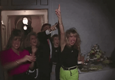 Group Of Women Posing One In Neon Green Shorts GIF
