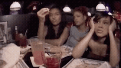 Group Of Women Sitting At Diner Table With Drinks GIF