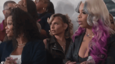 Group Of Women Sitting In Crowd GIF