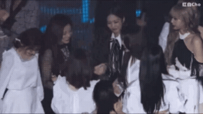Group Of Women Standing Around Table GIF