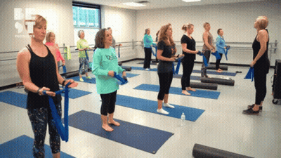 Group Of Women Standing On Yoga Mats With Be St Logo GIF