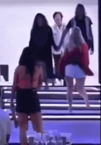 Group Of Women Walking Down Staircase Holding Hands GIF