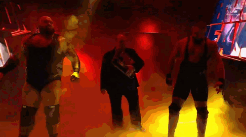 Group of Wrestlers in Dark Room With Red Light