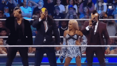 Group Of Wrestlers In Ring Wearing Masks GIF