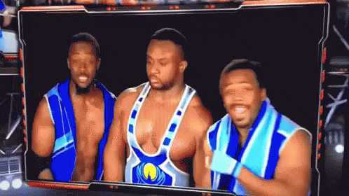 Group Of Wrestlers Standing Together GIF