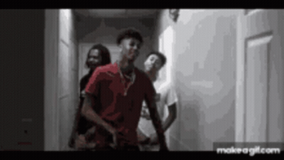 Group Of Young Men In Hallway One In Red Shirt GIF