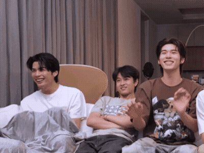 Group Of Young Men Laughing On Couch GIF
