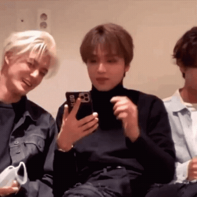 Group Of Young Men One Holding Cell Phone GIF
