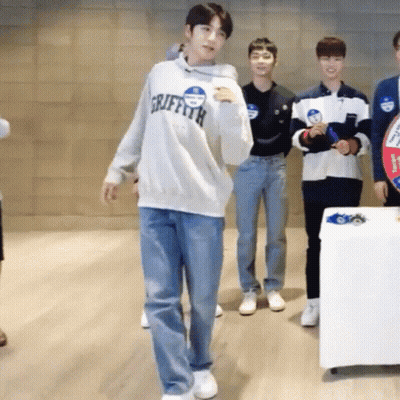 Group Of Young Men One Wearing Griffith Sweatshirt GIF