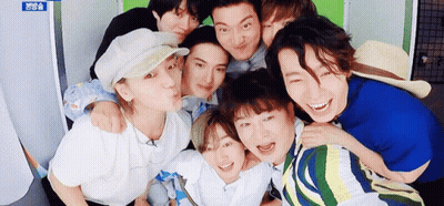 Group Of Young Men Posing And Smiling GIF