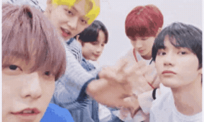 Group Of Young Men Posing For Picture GIF