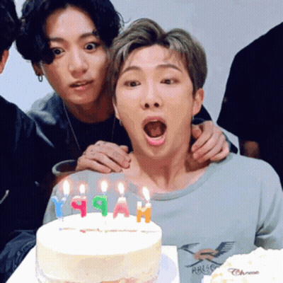 Group Of Young Men Posing With Birthday Cake GIF