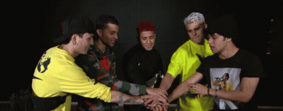 Group Of Young Men Putting Hands Together GIF