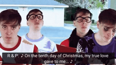 Group Of Young Men Singing Christmas Carols GIF