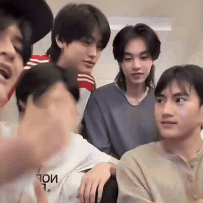 Group Of Young Men Sitting And Talking GIF