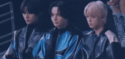 Group Of Young Men Sitting In A Row GIF