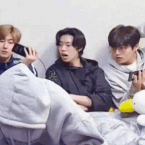 Group Of Young Men Sitting Next To Each Other On Couch GIF