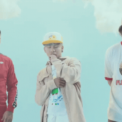 Group Of Young Men Standing In Front Of Blue Background GIF