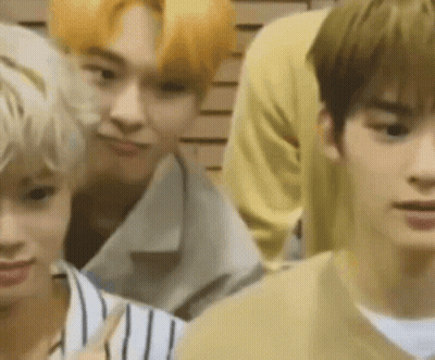 Group Of Young Men Standing In Front Of Wall GIF