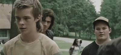 Group Of Young Men Standing On Street GIF