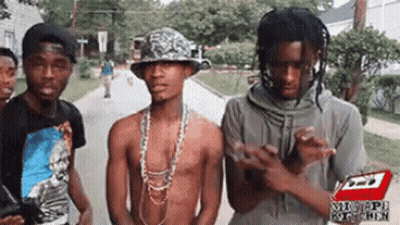 Group Of Young Men Standing On Street GIF