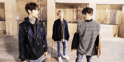 Group Of Young Men Standing Together In Room GIF