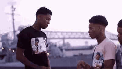 Group Of Young Men Talking Near Bridge GIF
