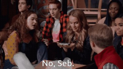 Group Of Young People Sitting Around Table Saying No Seb GIF