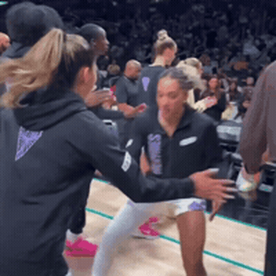 Group On Basketball Court One In Black Hoodie GIF