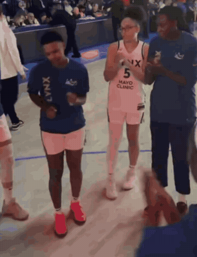 Group On Basketball Court Wearing Mayo Clinic Shirt GIF