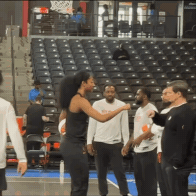 Group On Basketball Court With NBA Shirt GIF