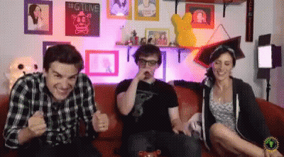 Group On Couch With Big Live Sign GIF