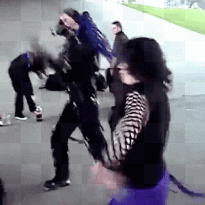 Group On Sidewalk One In Black And White Striped Shirt GIF