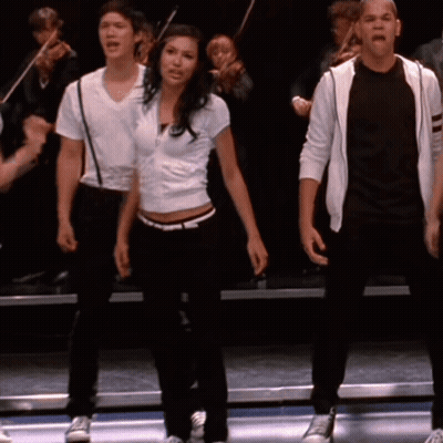 Group On Stage One In White Shirt GIF