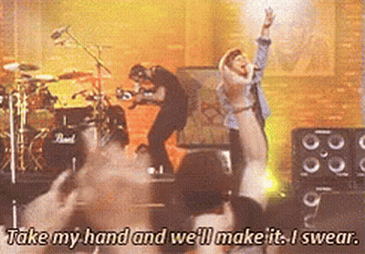 Group On Stage Saying Take My Hand And We'll Make It Swear GIF