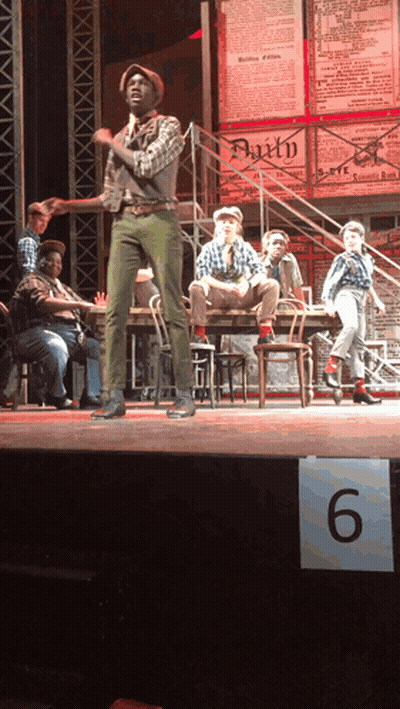 Group On Stage With 6 Sign GIF