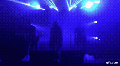 Group On Stage With Blue Lights GIF
