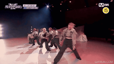 Group Performing On Stage With Mnet Logo GIF