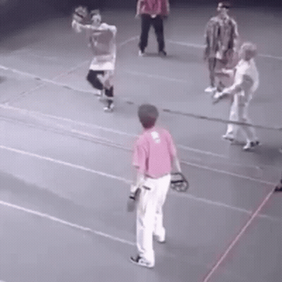 Group Playing Baseball On Court GIF