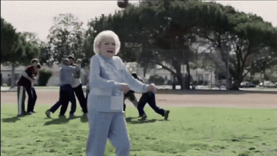 Group Playing Baseball With Elderly Woman GIF