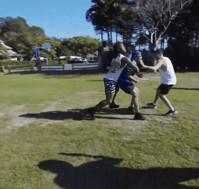 Group Playing Basketball In Field GIF