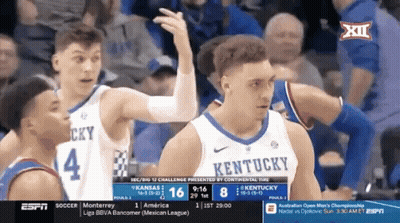 Group Playing Game In Front Of Louisville Sign GIF