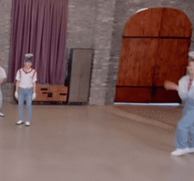 Group Playing Game In Room With Wooden Door GIF