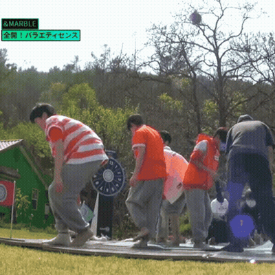 Group Playing Game With Green Sign Saying Marble GIF