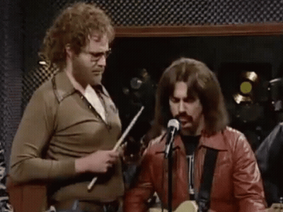 Group Playing Guitars And Singing Into Microphones GIF